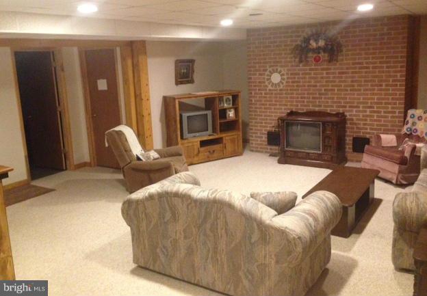 11833 Cash Smith Road Keymar, MD 21757 - Photo 12 of 16 a bed room with furniture and a fireplace