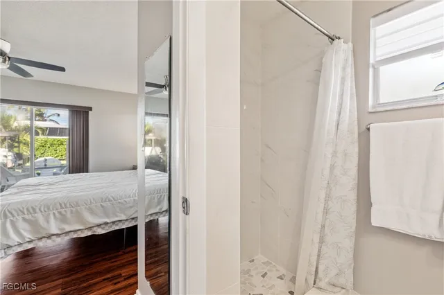 a room with a bed and a window