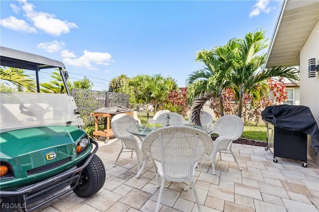a view of a chairs and table in a patio