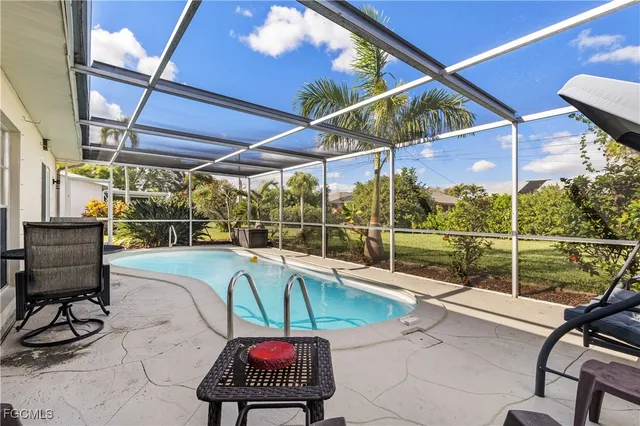 a view of a swimming pool with a patio