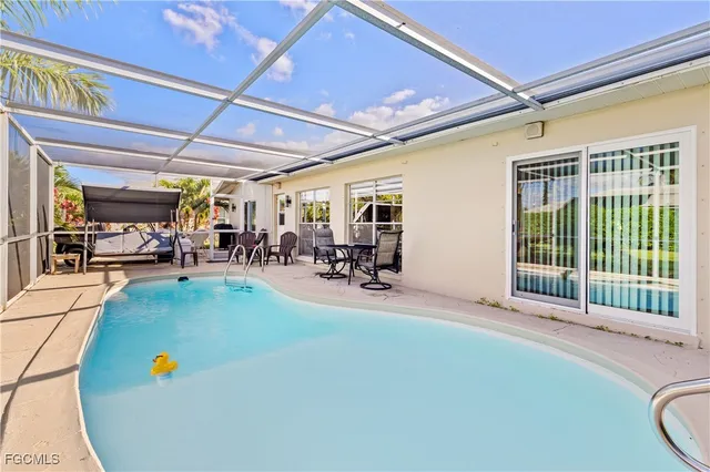 a view of a patio with a table and chairs