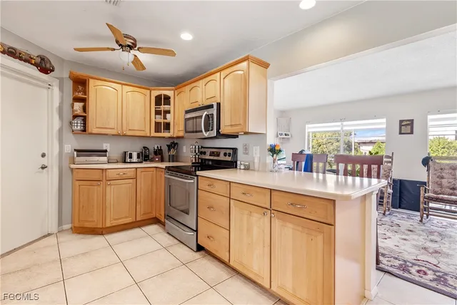 a kitchen with stainless steel appliances granite countertop a stove and cabinets