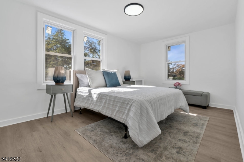 288 Harrison Street Nutley, NJ 07110 - Photo 11 of 21 a bedroom with a bed and window