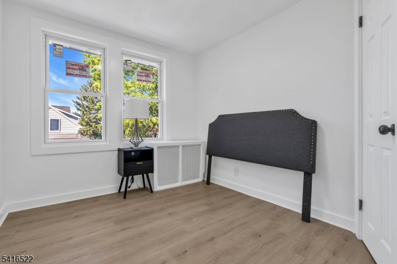 288 Harrison Street Nutley, NJ 07110 - Photo 12 of 21 a living room with furniture and a window
