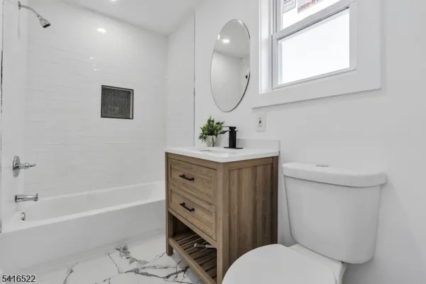 a bathroom with a sink toilet and bathtub