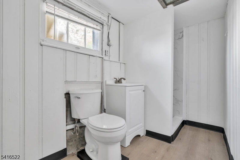 288 Harrison Street Nutley, NJ 07110 - Photo 17 of 21 a white toilet sitting next to a bathroom sink