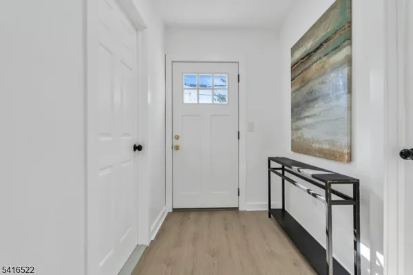 a view of a hallway with front door