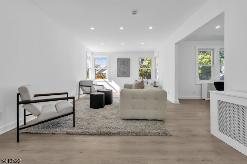 288 Harrison Street Nutley, NJ 07110 - Photo 3 of 21 a living room with furniture rug and window