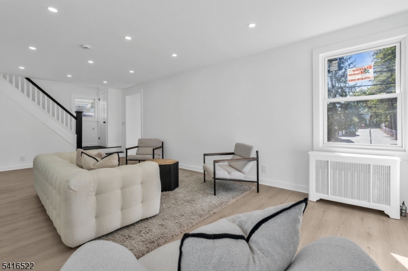 288 Harrison Street Nutley, NJ 07110 - Photo 4 of 21 a living room with furniture and a window