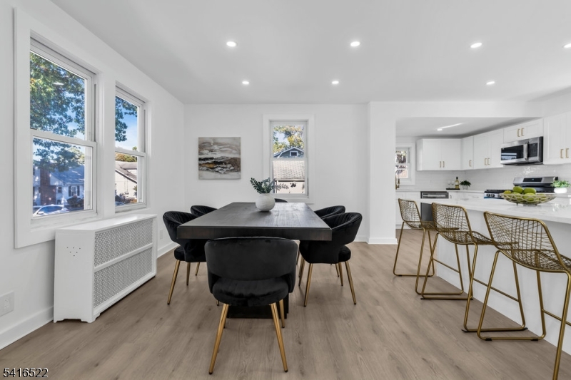 288 Harrison Street Nutley, NJ 07110 - Photo 5 of 21 a view of a dining room with furniture and wooden floor