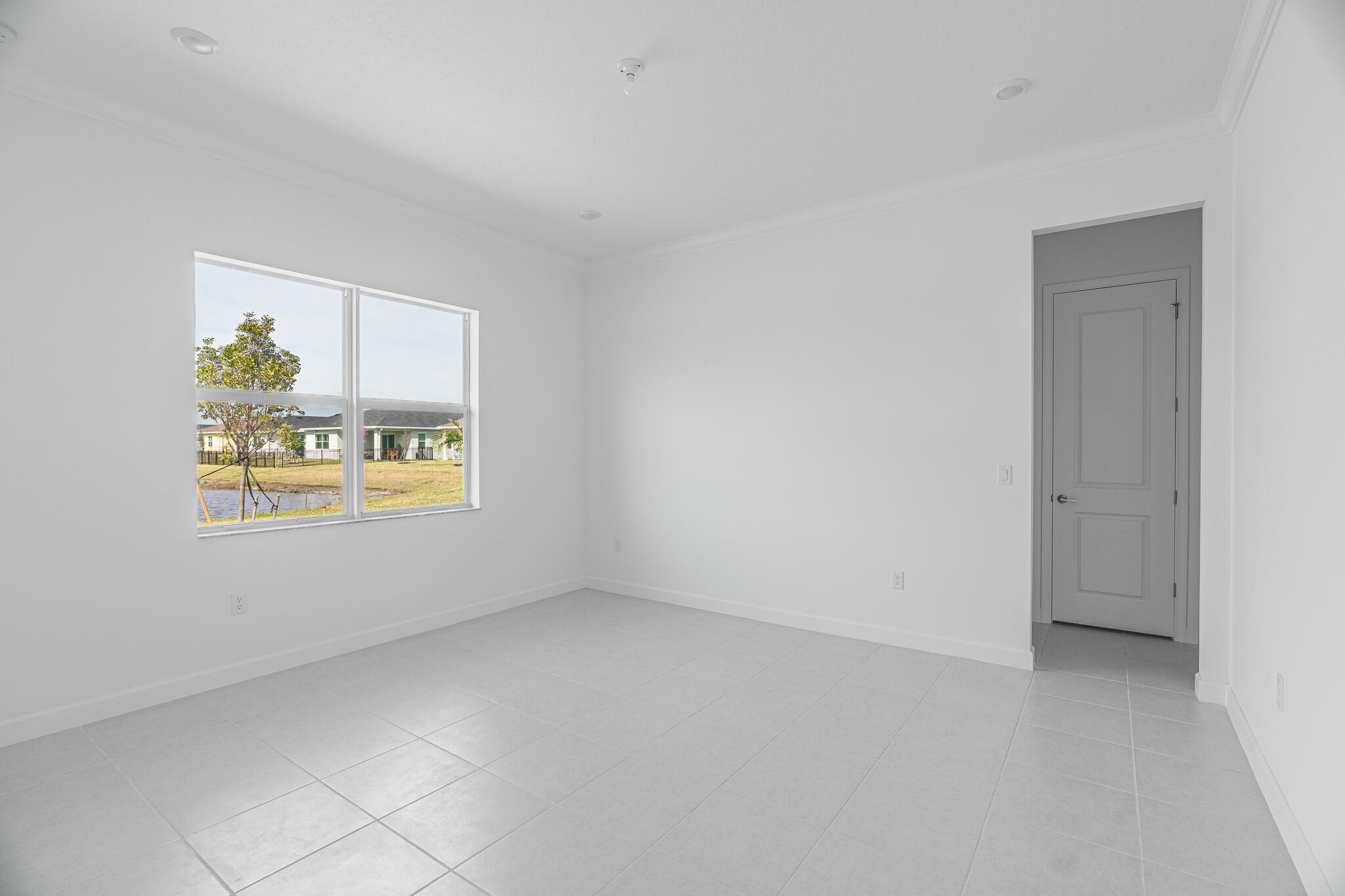 13885 Southeast Riversway St Port Port St. Lucie, FL 34984 - Photo 13 of 35 a view of an empty room with a window