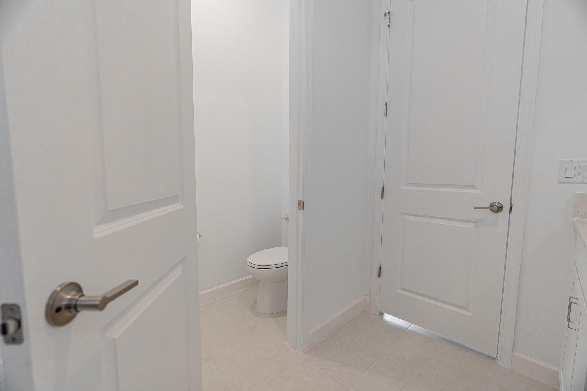 13885 Southeast Riversway St Port Port St. Lucie, FL 34984 - Photo 16 of 35 a bathroom with a granite countertop toilet and a shower