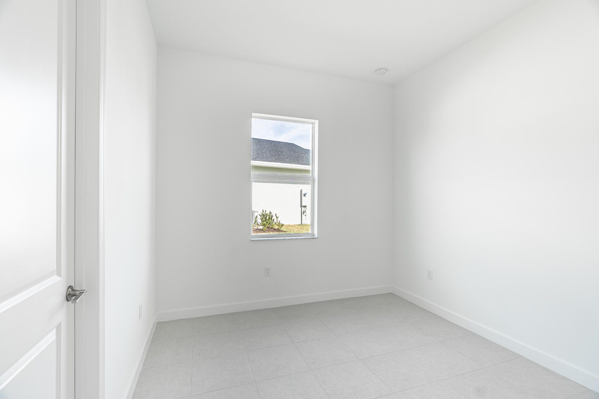 13885 Southeast Riversway St Port Port St. Lucie, FL 34984 - Photo 24 of 35 a view of an empty room with a window