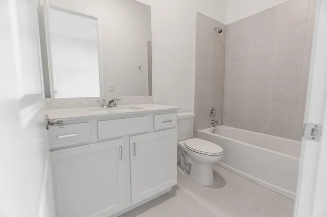 a view of an house with backyard space and balcony