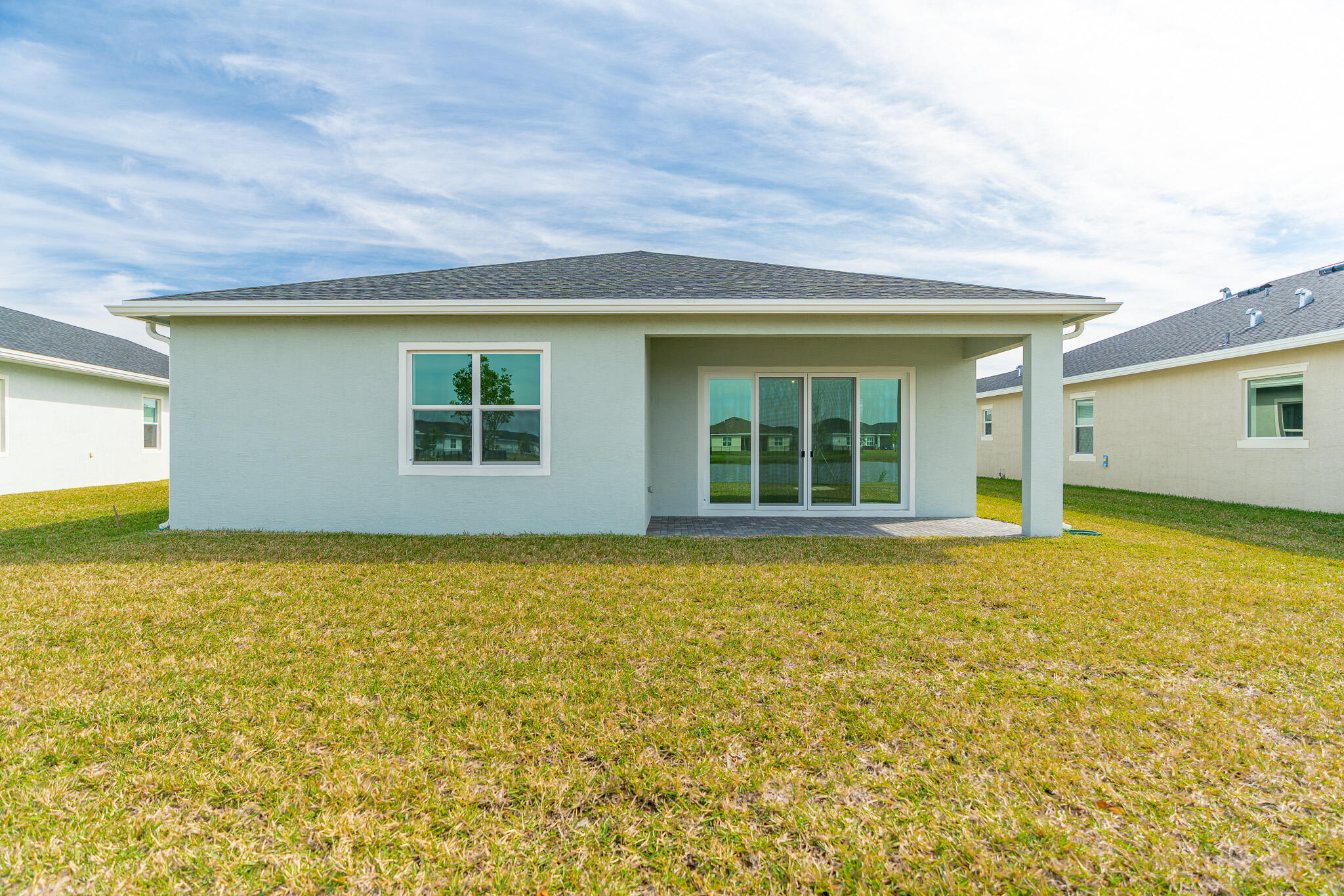 13885 Southeast Riversway St Port Port St. Lucie, FL 34984 - Photo 27 of 35 a view of an house with backyard space and balcony