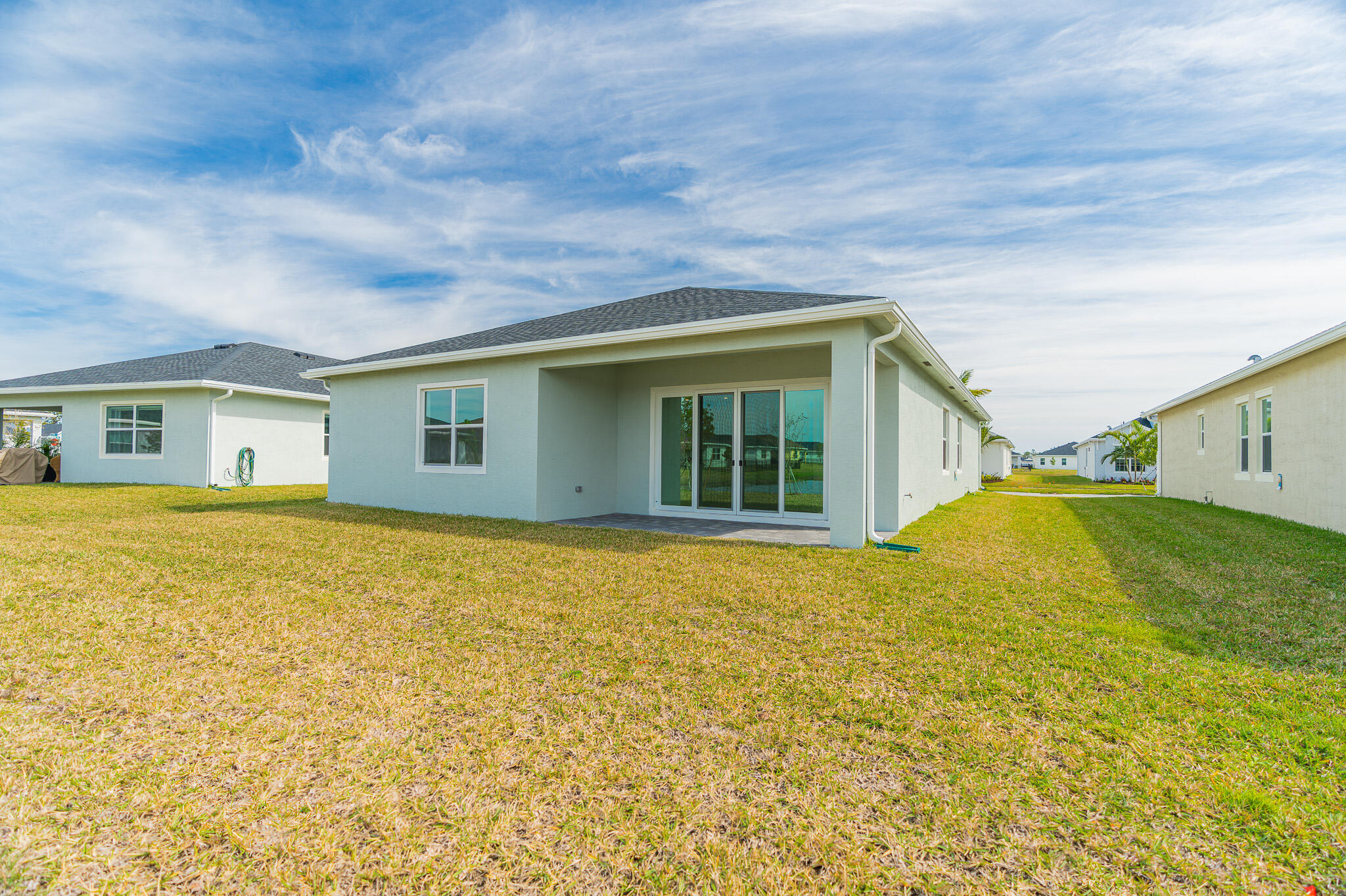 13885 Southeast Riversway St Port Port St. Lucie, FL 34984 - Photo 28 of 35 a view of outdoor space yard and front view of house