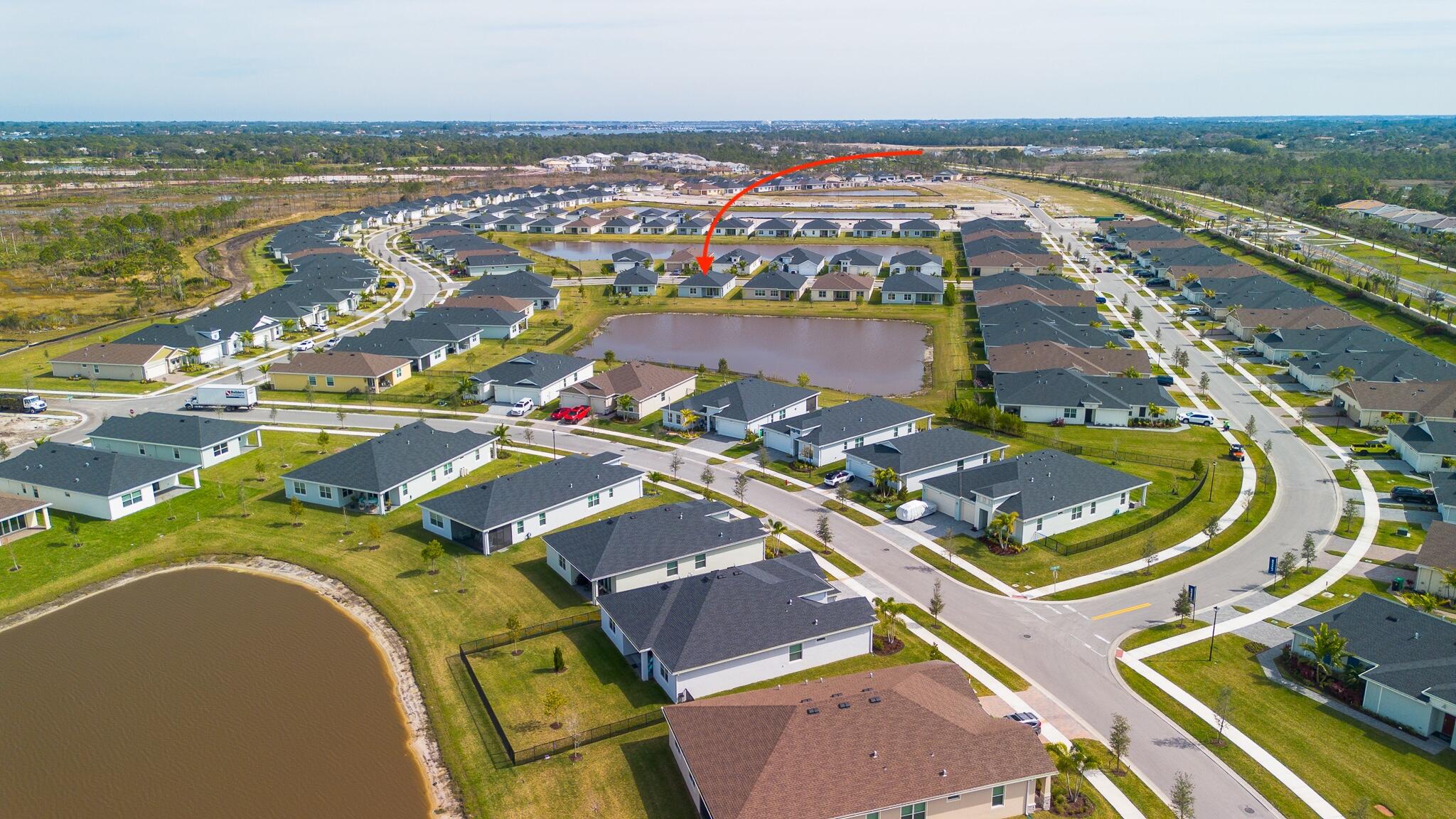 13885 Southeast Riversway St Port Port St. Lucie, FL 34984 - Photo 32 of 35 an aerial view of residential houses with outdoor space