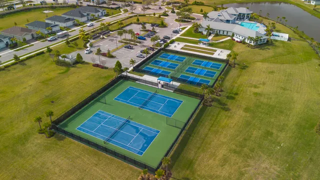 an aerial view of residential houses with outdoor space
