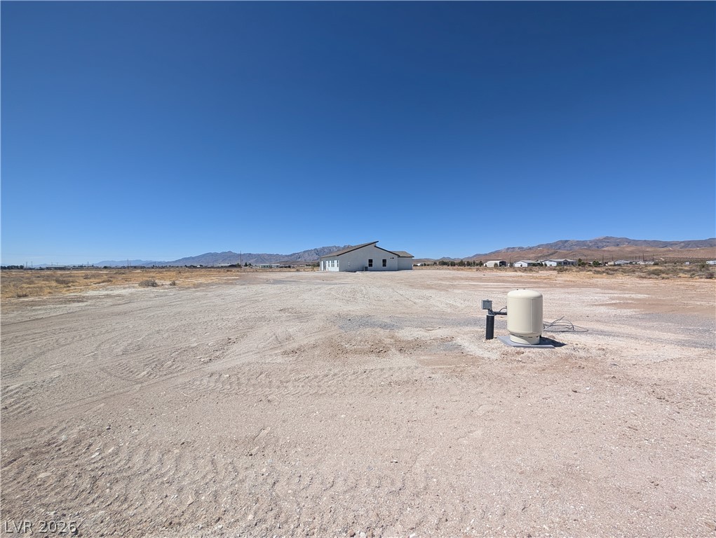 4670 Medicine Man Road Pahrump, NV 89048 - Photo 27 of 36 A newly constructed residence sits amidst a vast, undeveloped lot with distant mountain views.