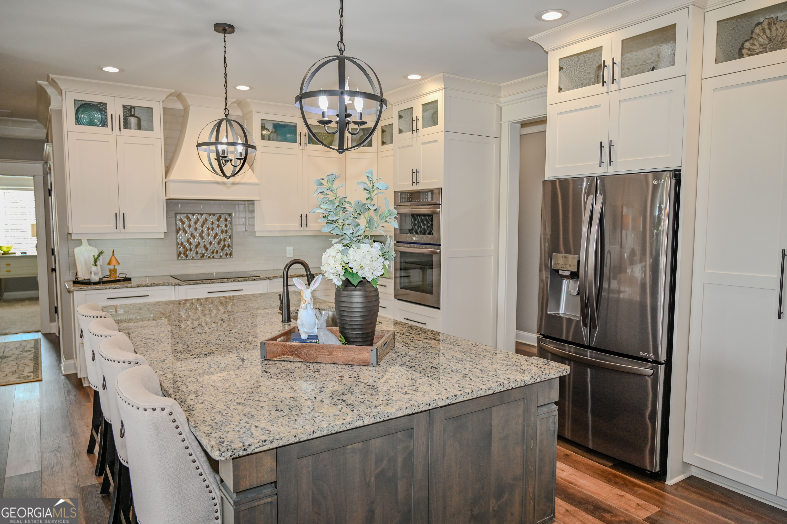 399 Overlook Trail Williamson, GA 30292 - Photo 12 of 52 a kitchen with stainless steel appliances granite countertop a refrigerator and a sink