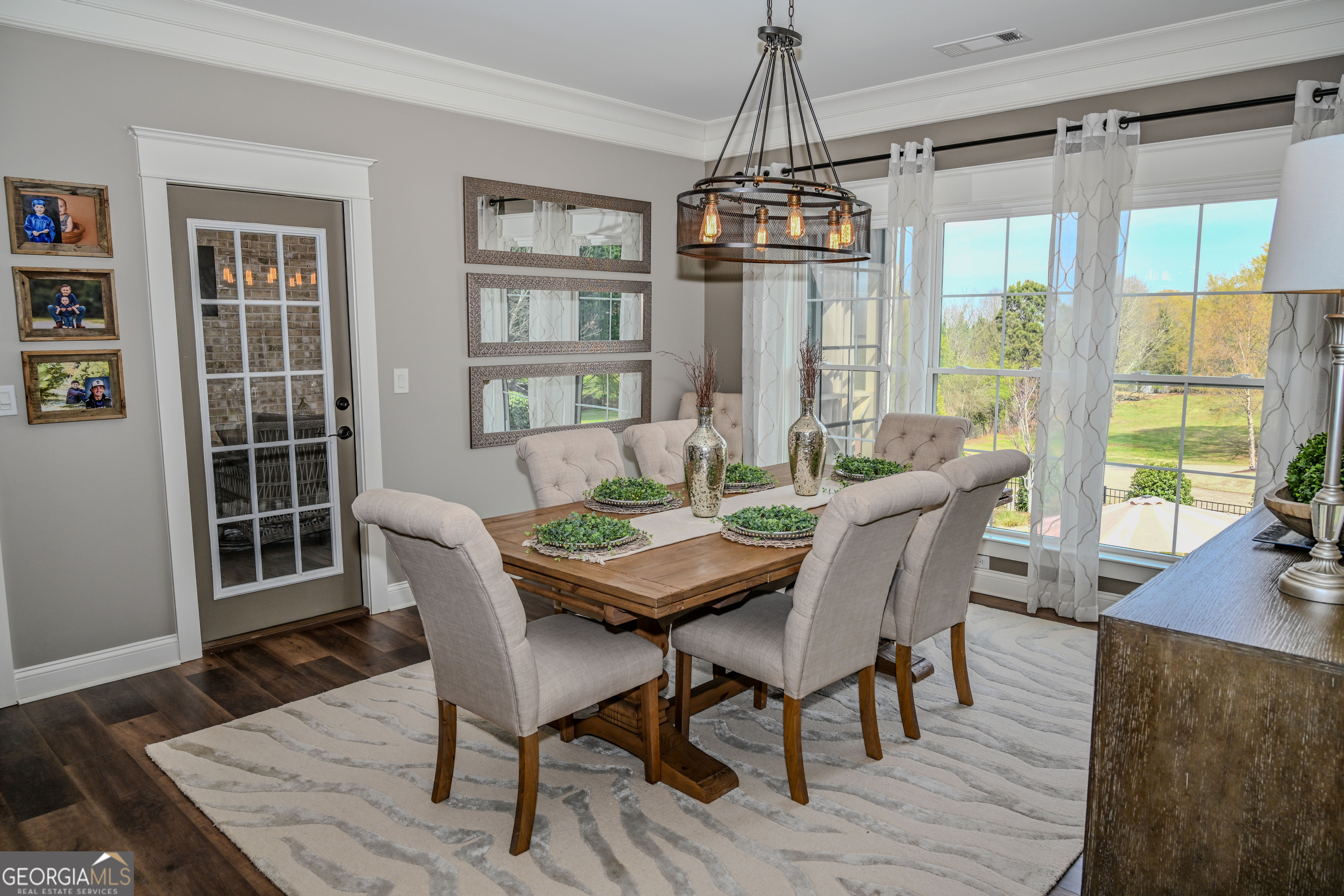 399 Overlook Trail Williamson, GA 30292 - Photo 16 of 52 a view of a dining room with furniture window and wooden floor