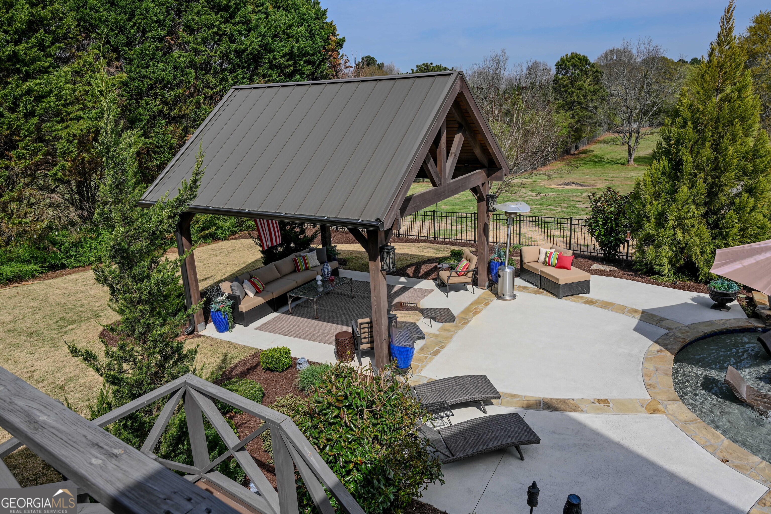 399 Overlook Trail Williamson, GA 30292 - Photo 19 of 52 an outdoor space with seating area and trees