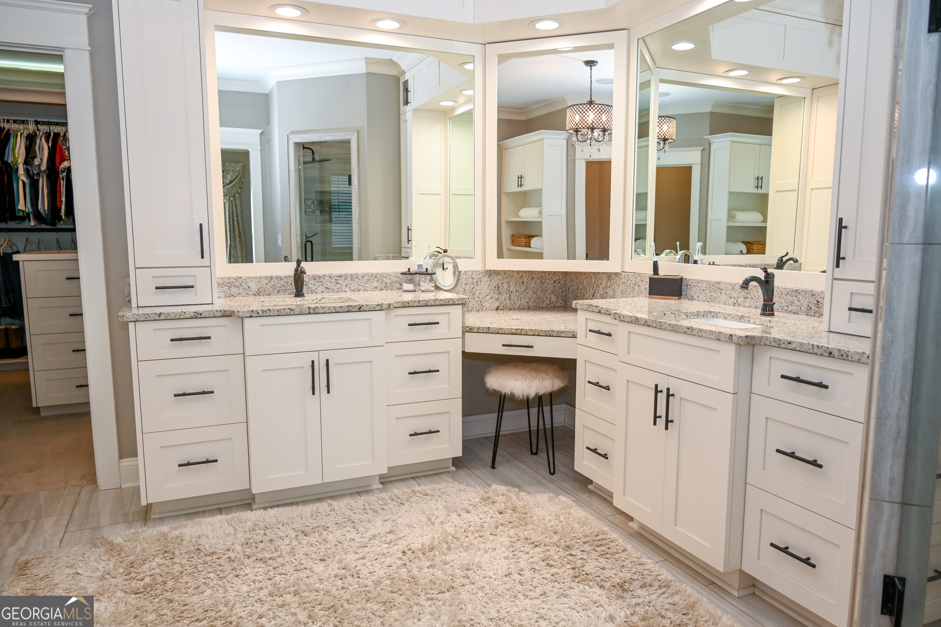 399 Overlook Trail Williamson, GA 30292 - Photo 23 of 52 a spacious bathroom with a granite countertop sink and a mirror