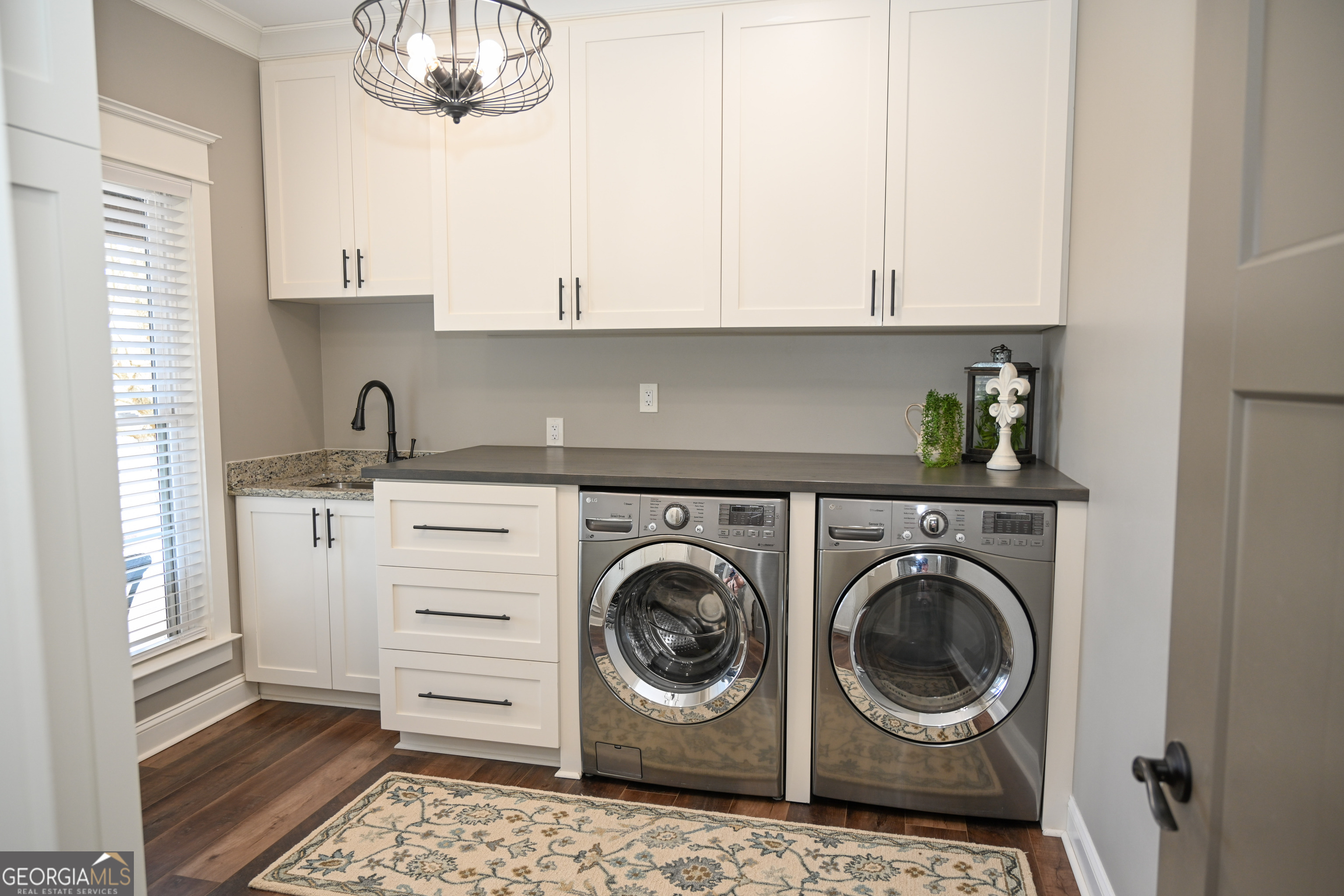 399 Overlook Trail Williamson, GA 30292 - Photo 27 of 52 a utility room with sink dryer and washer