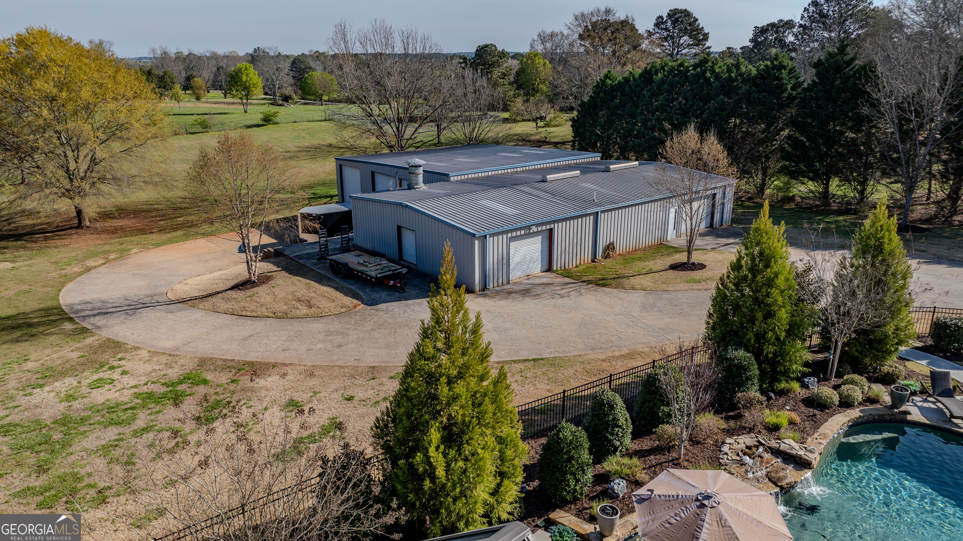 399 Overlook Trail Williamson, GA 30292 - Photo 3 of 52 an aerial view of a house with a yard