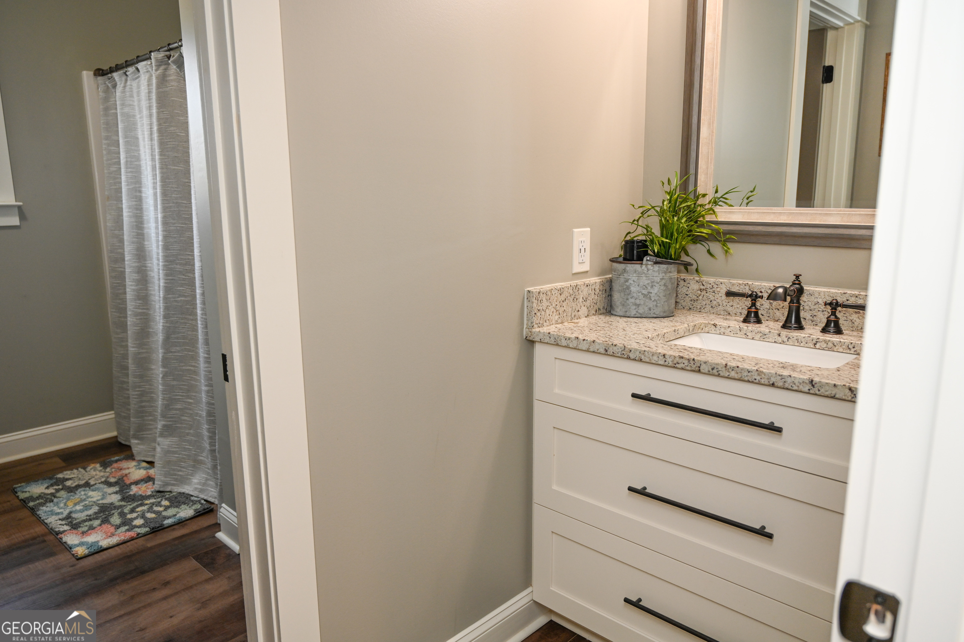 399 Overlook Trail Williamson, GA 30292 - Photo 32 of 52 a bathroom with a sink and a mirror