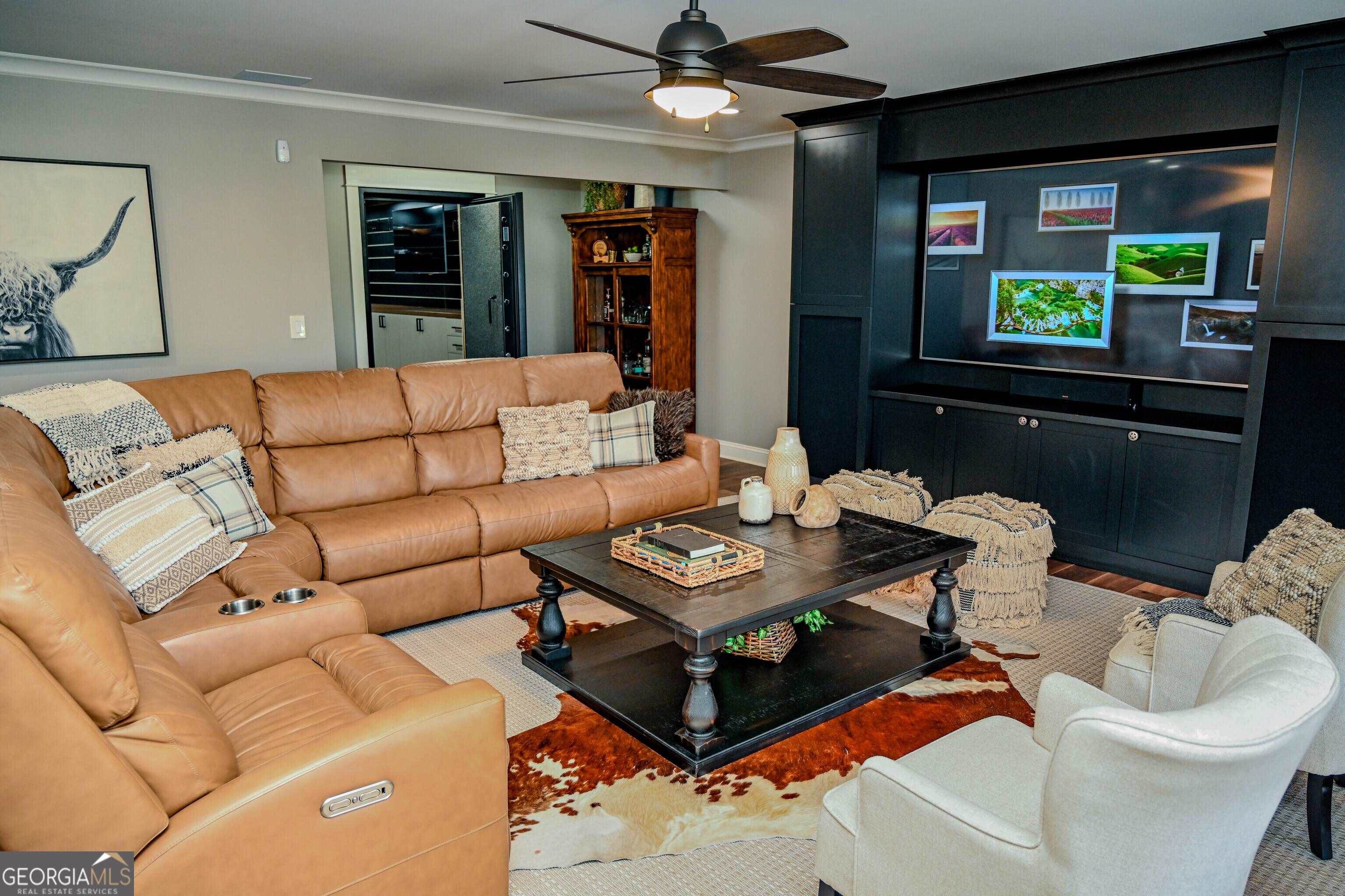 399 Overlook Trail Williamson, GA 30292 - Photo 36 of 52 a living room with furniture and a flat screen tv