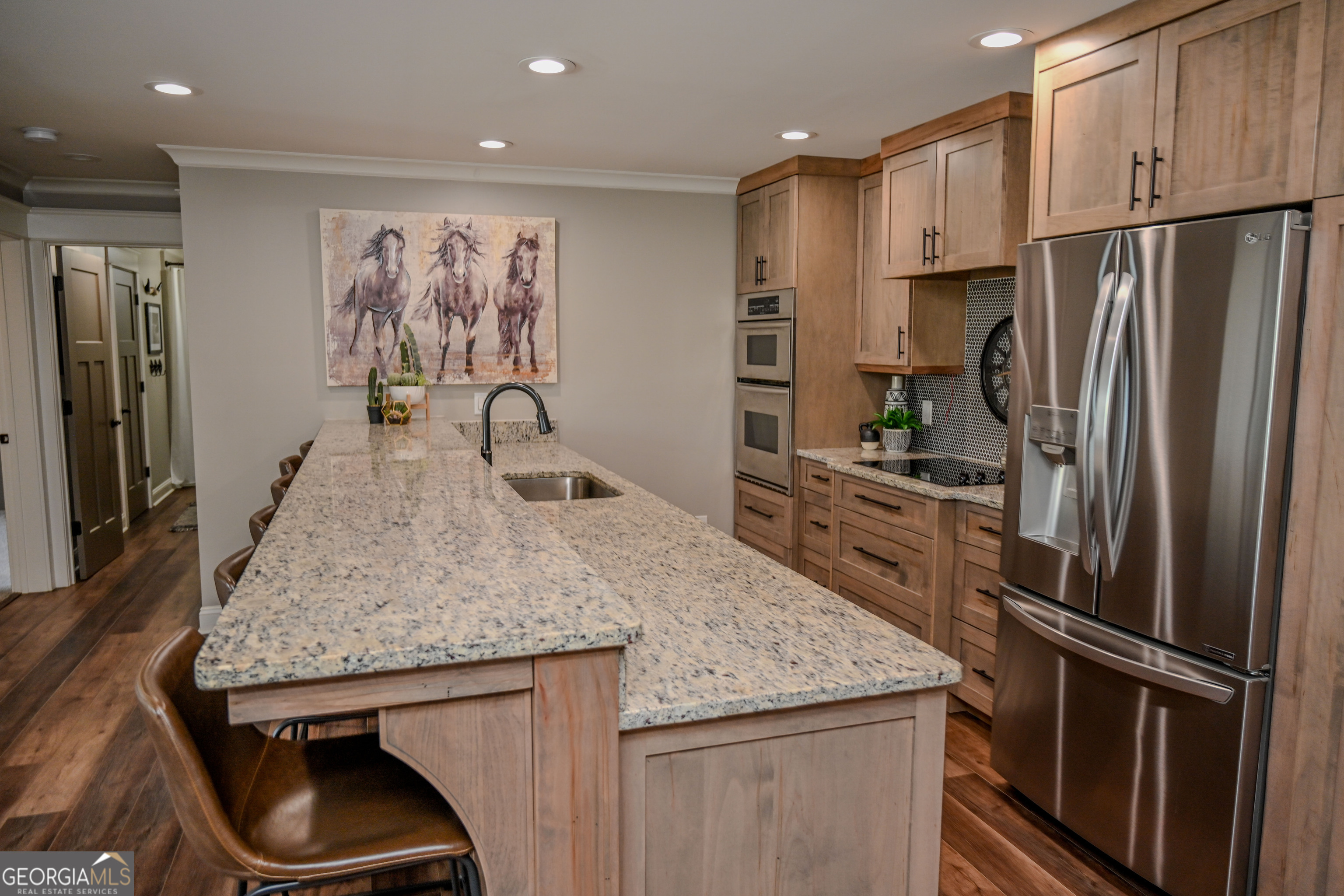 399 Overlook Trail Williamson, GA 30292 - Photo 37 of 52 a kitchen with stainless steel appliances granite countertop a refrigerator and a stove