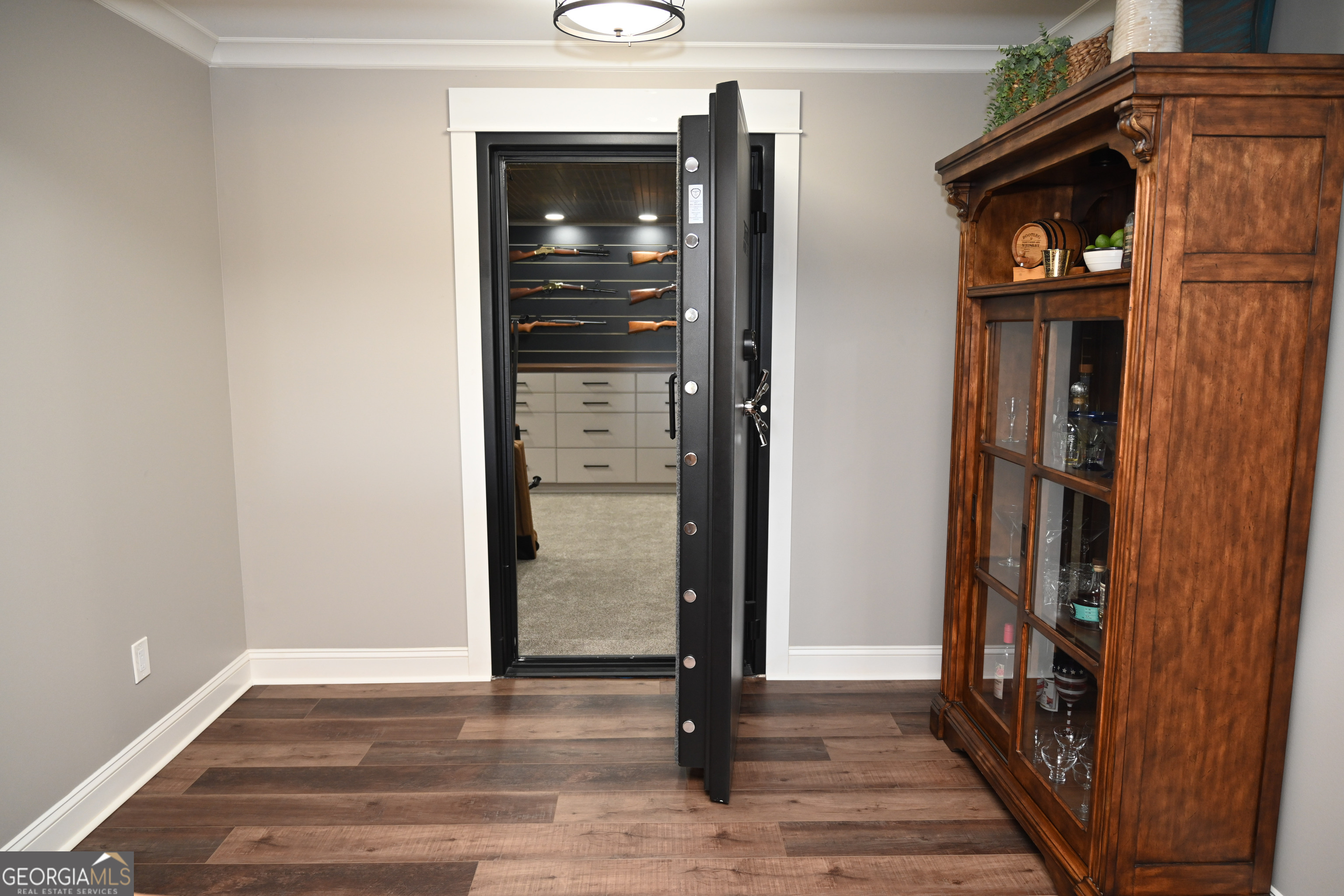 399 Overlook Trail Williamson, GA 30292 - Photo 39 of 52 a view of a hallway with wooden floor and staircase