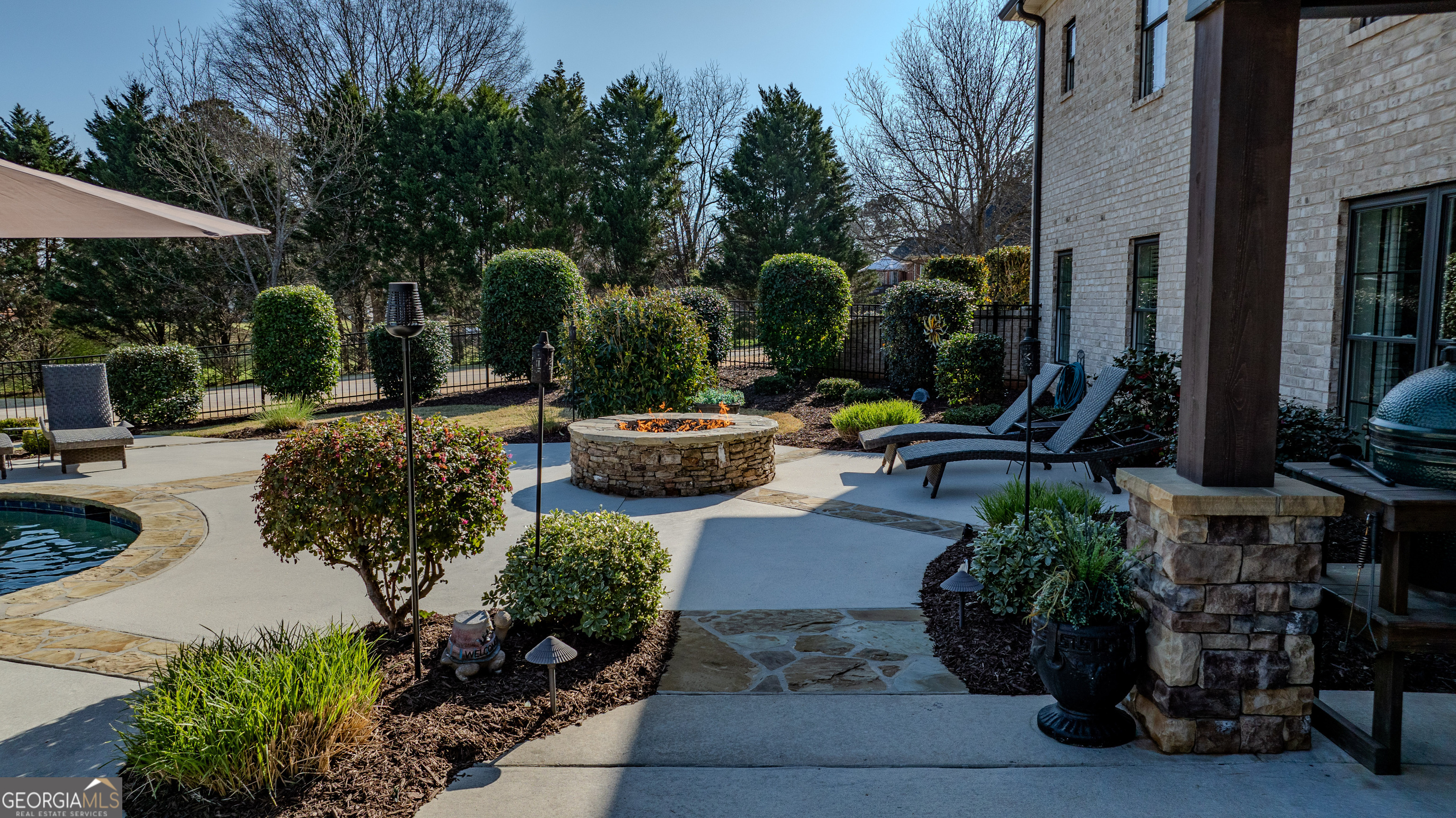 399 Overlook Trail Williamson, GA 30292 - Photo 52 of 52 a view of a backyard with sitting area and furniture