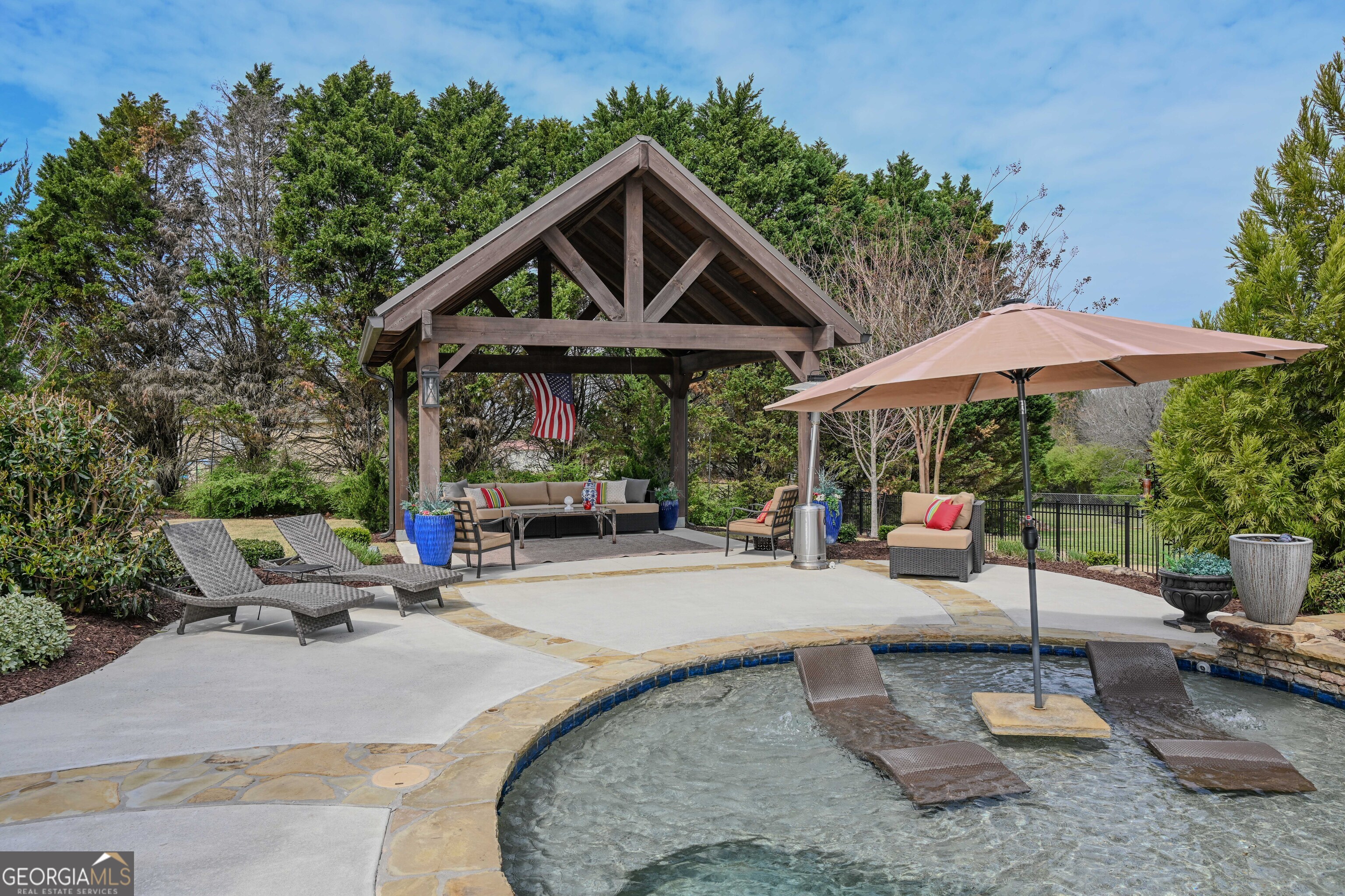 399 Overlook Trail Williamson, GA 30292 - Photo 10 of 52 a backyard of a house with table and chairs