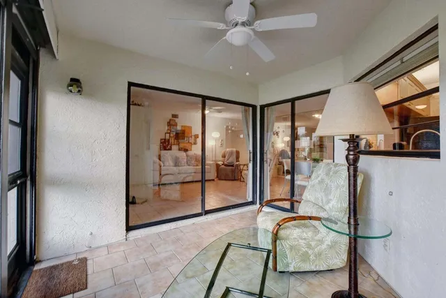 a view of a livingroom with furniture and bathroom