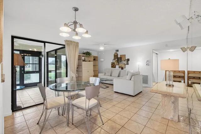 a kitchen with granite countertop a sink stainless steel appliances and cabinets