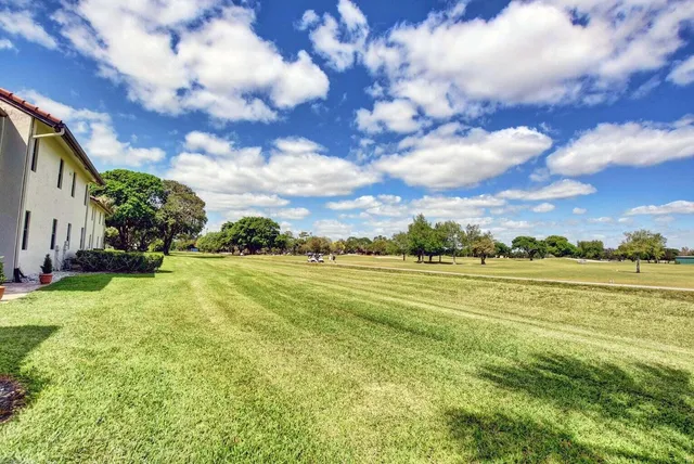 an aerial view of house with yard swimming pool and outdoor seating