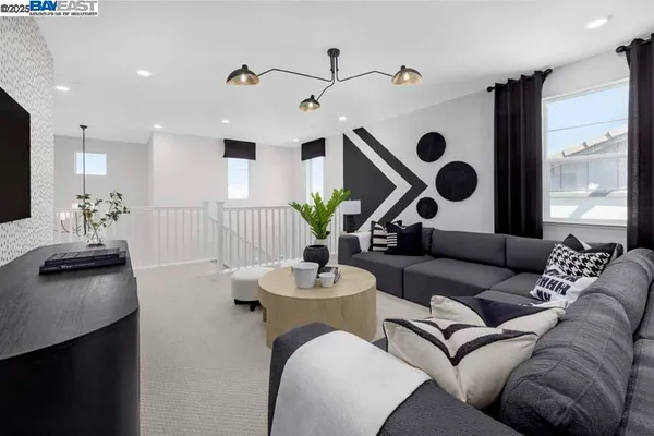 a living room with furniture and a large mirror