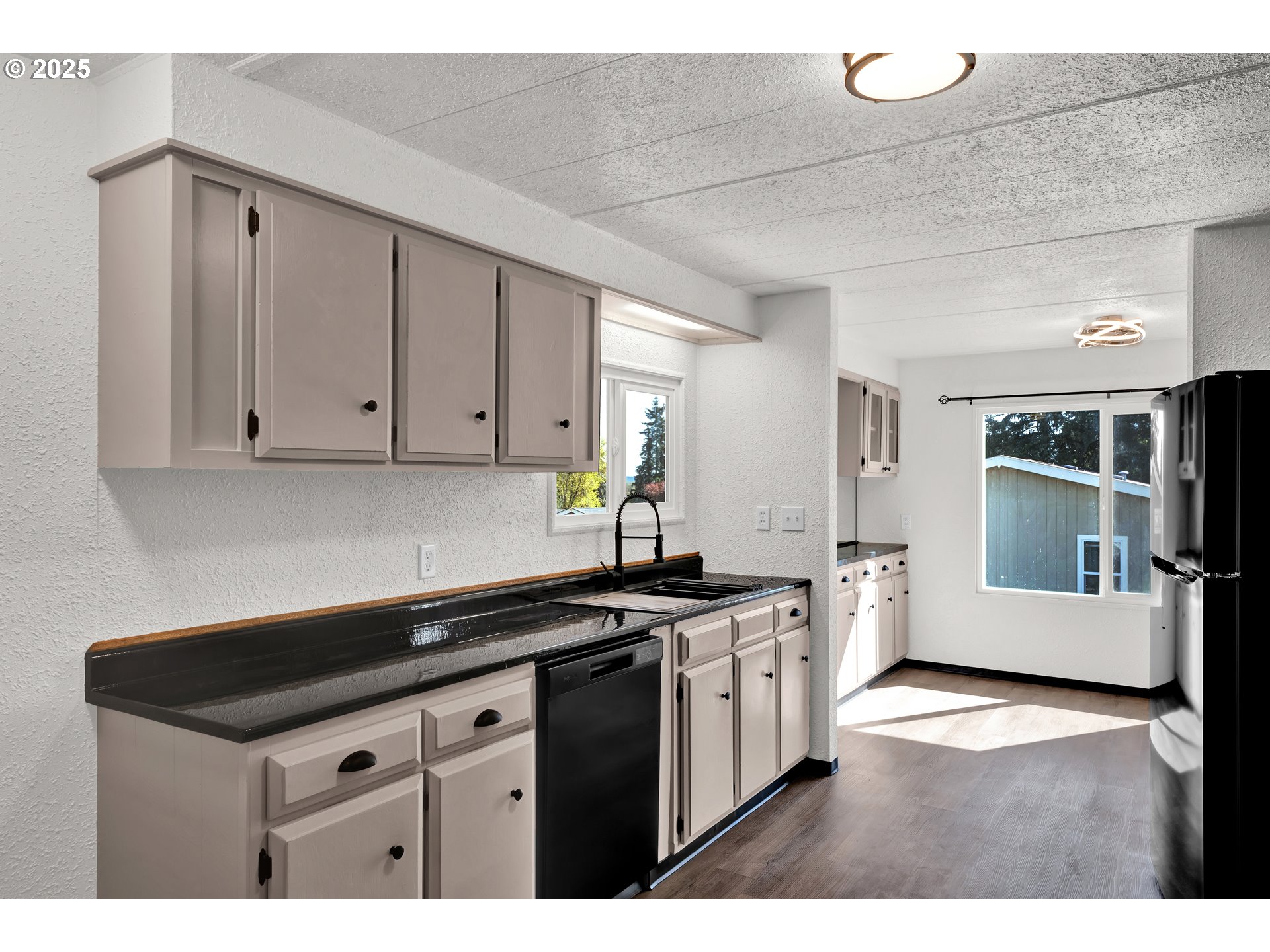 5055 Northeast Elliott Circle, Unit 8 Corvallis, OR 97330 - Photo 13 of 35 a kitchen with a sink and cabinets