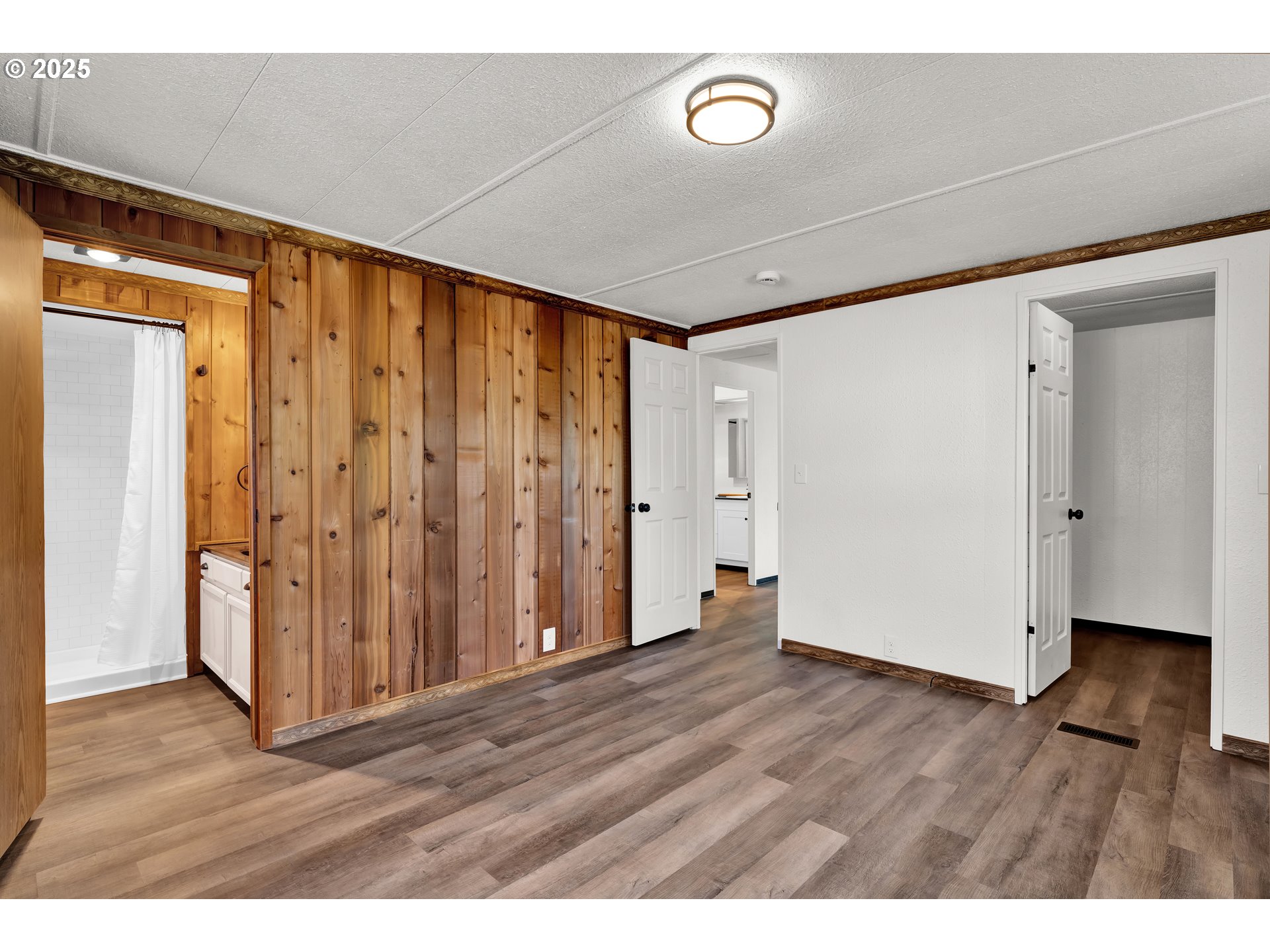 5055 Northeast Elliott Circle, Unit 8 Corvallis, OR 97330 - Photo 15 of 35 a view of an empty room with wooden floor