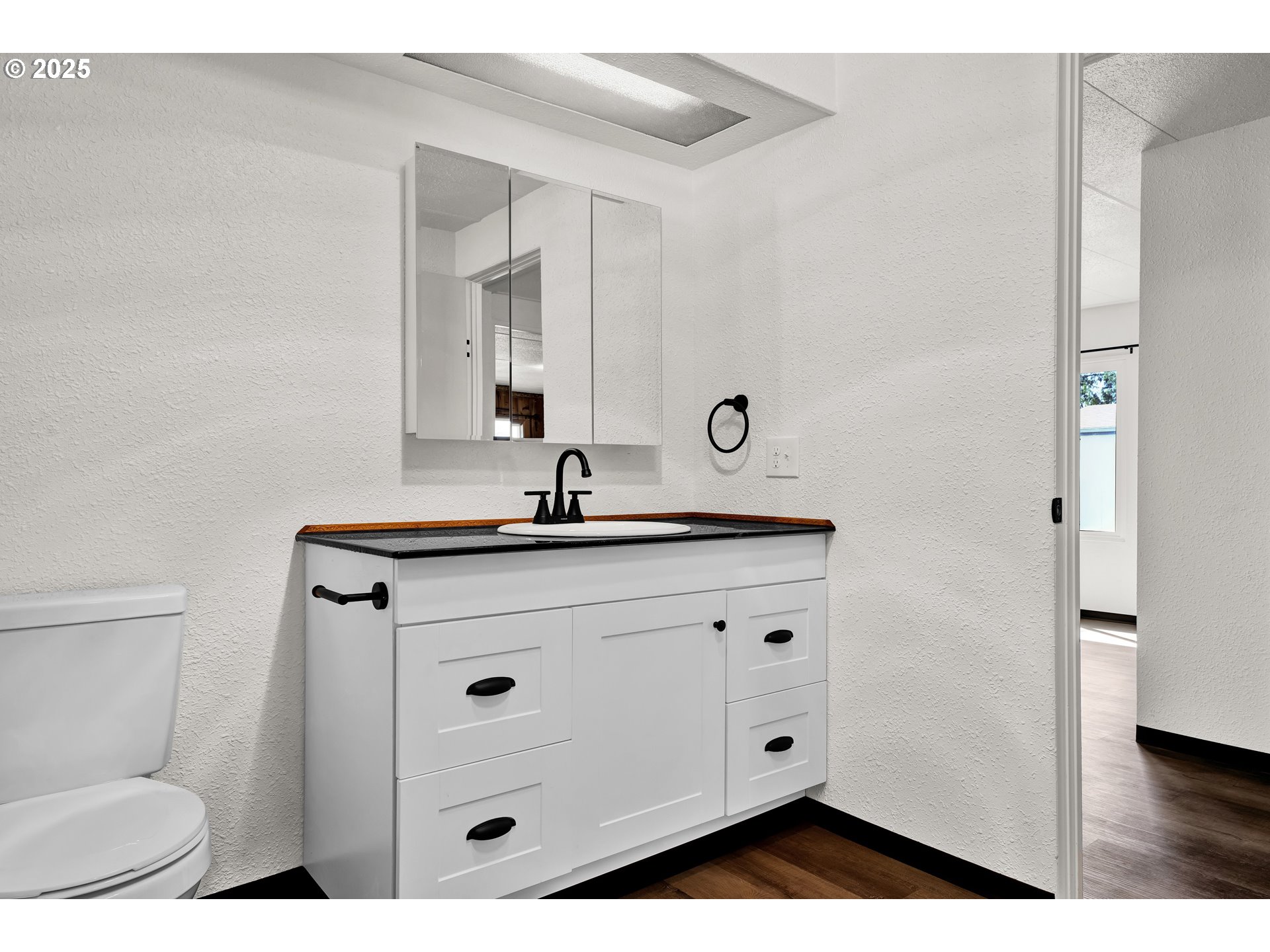 5055 Northeast Elliott Circle, Unit 8 Corvallis, OR 97330 - Photo 20 of 35 a bathroom with a sink and a mirror