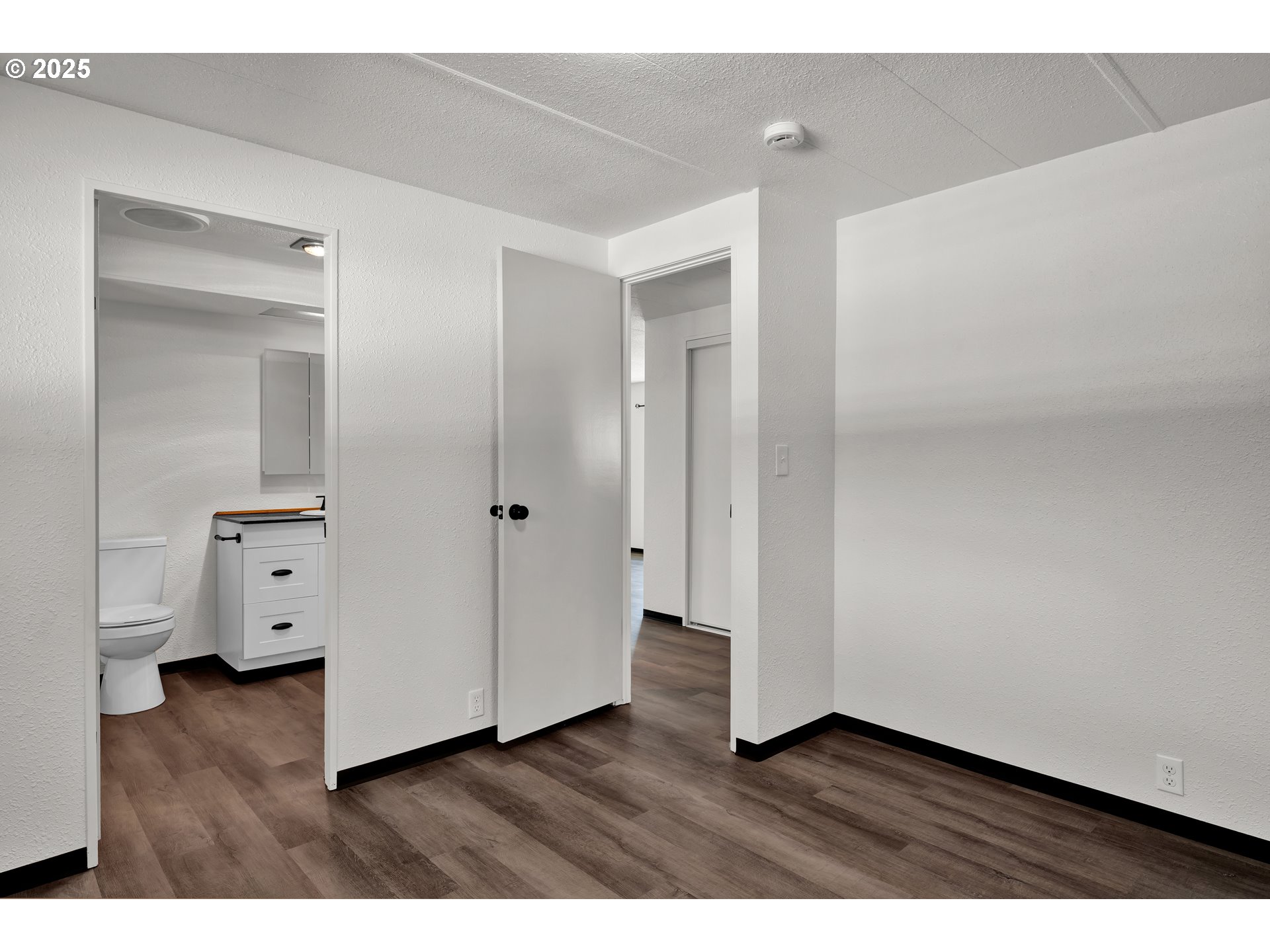 5055 Northeast Elliott Circle, Unit 8 Corvallis, OR 97330 - Photo 22 of 35 a view of an empty room and wooden floor