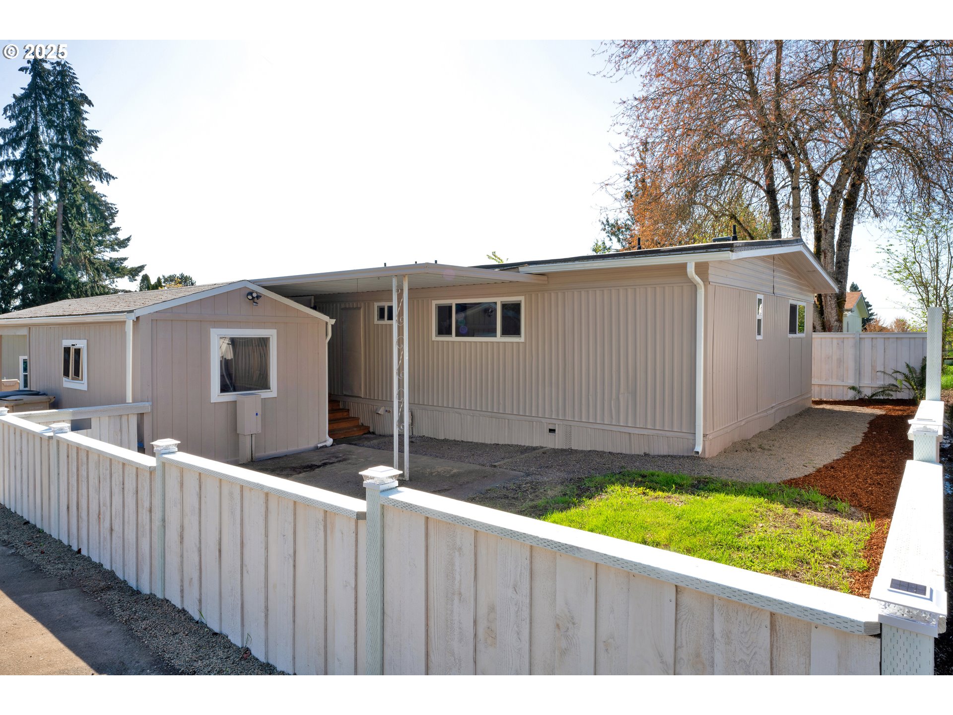 5055 Northeast Elliott Circle, Unit 8 Corvallis, OR 97330 - Photo 25 of 35 a view of a house with backyard and wooden fence