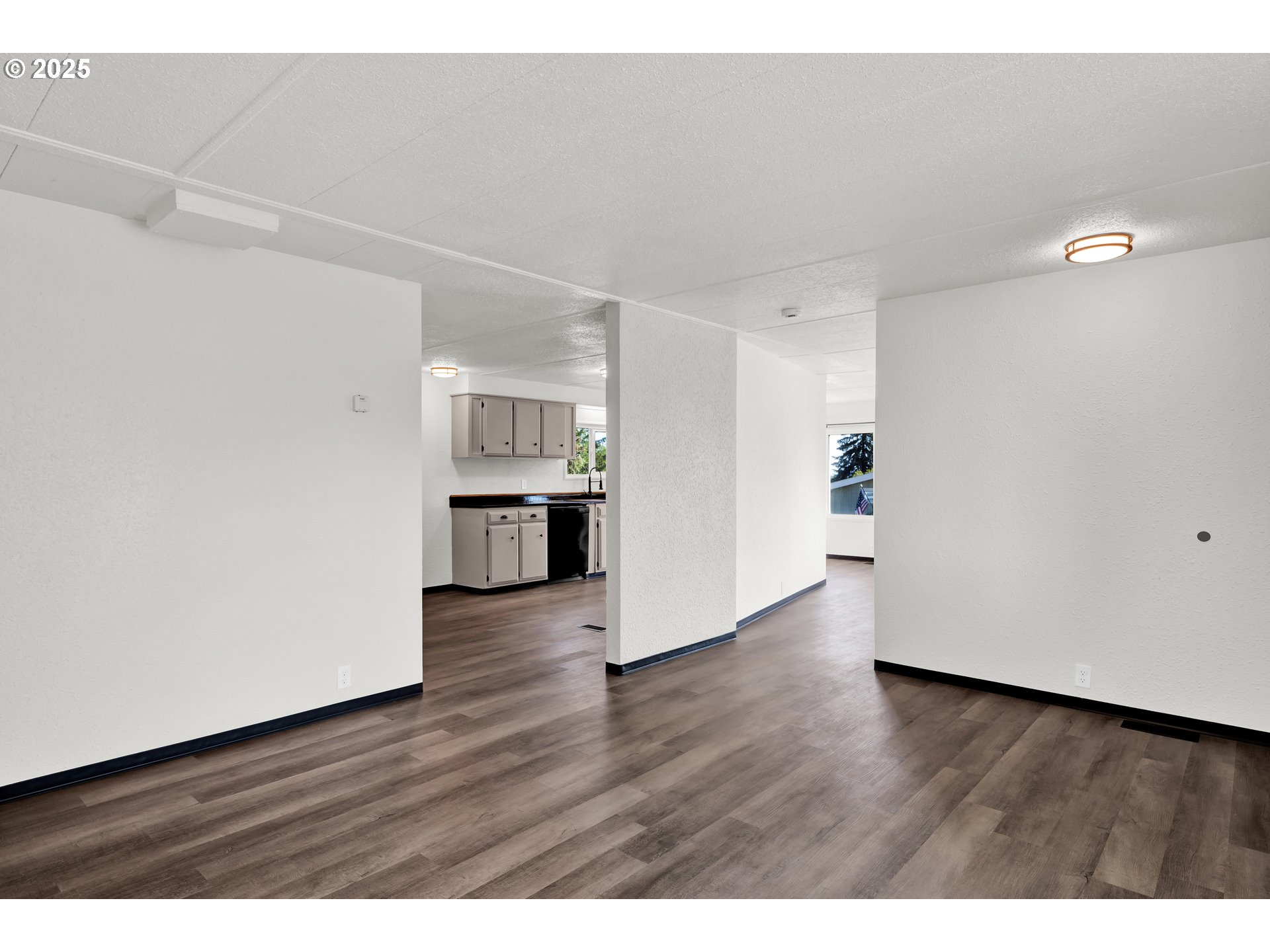 5055 Northeast Elliott Circle, Unit 8 Corvallis, OR 97330 - Photo 32 of 35 a view of empty room with wooden floor