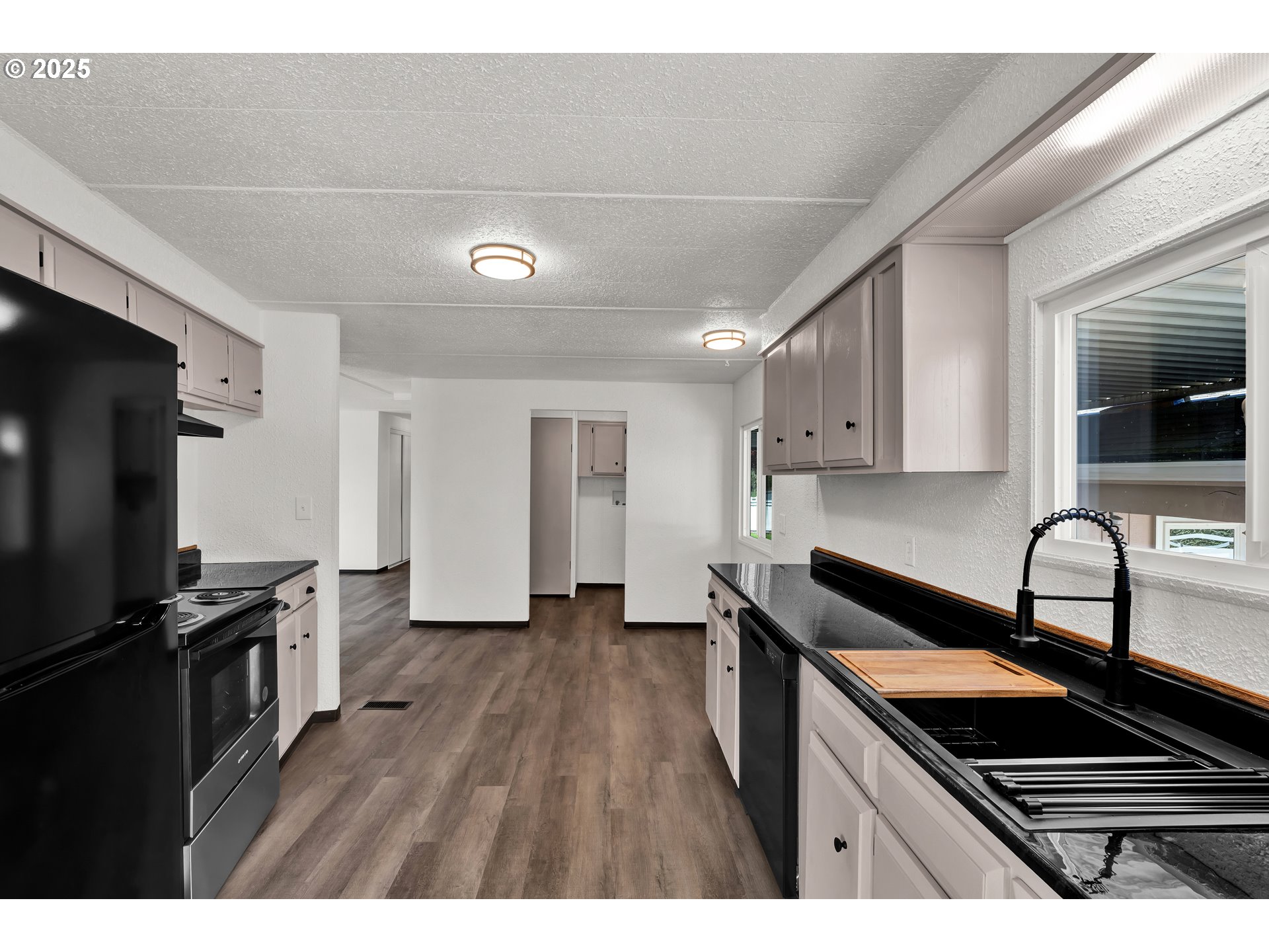 5055 Northeast Elliott Circle, Unit 8 Corvallis, OR 97330 - Photo 10 of 35 a kitchen with granite countertop stainless steel appliances and wooden cabinets