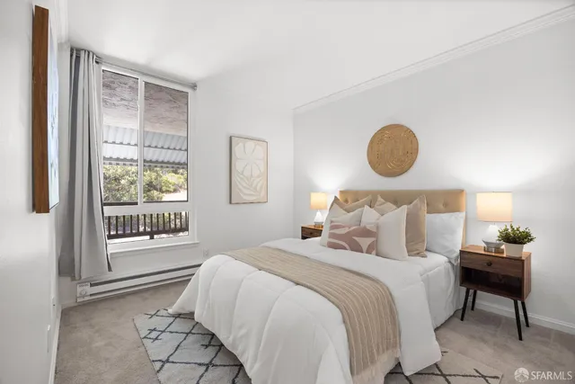 a bedroom with a bed and a view of bathroom