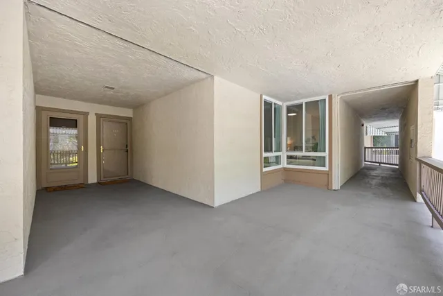 a view of a hallway with washer and dryer