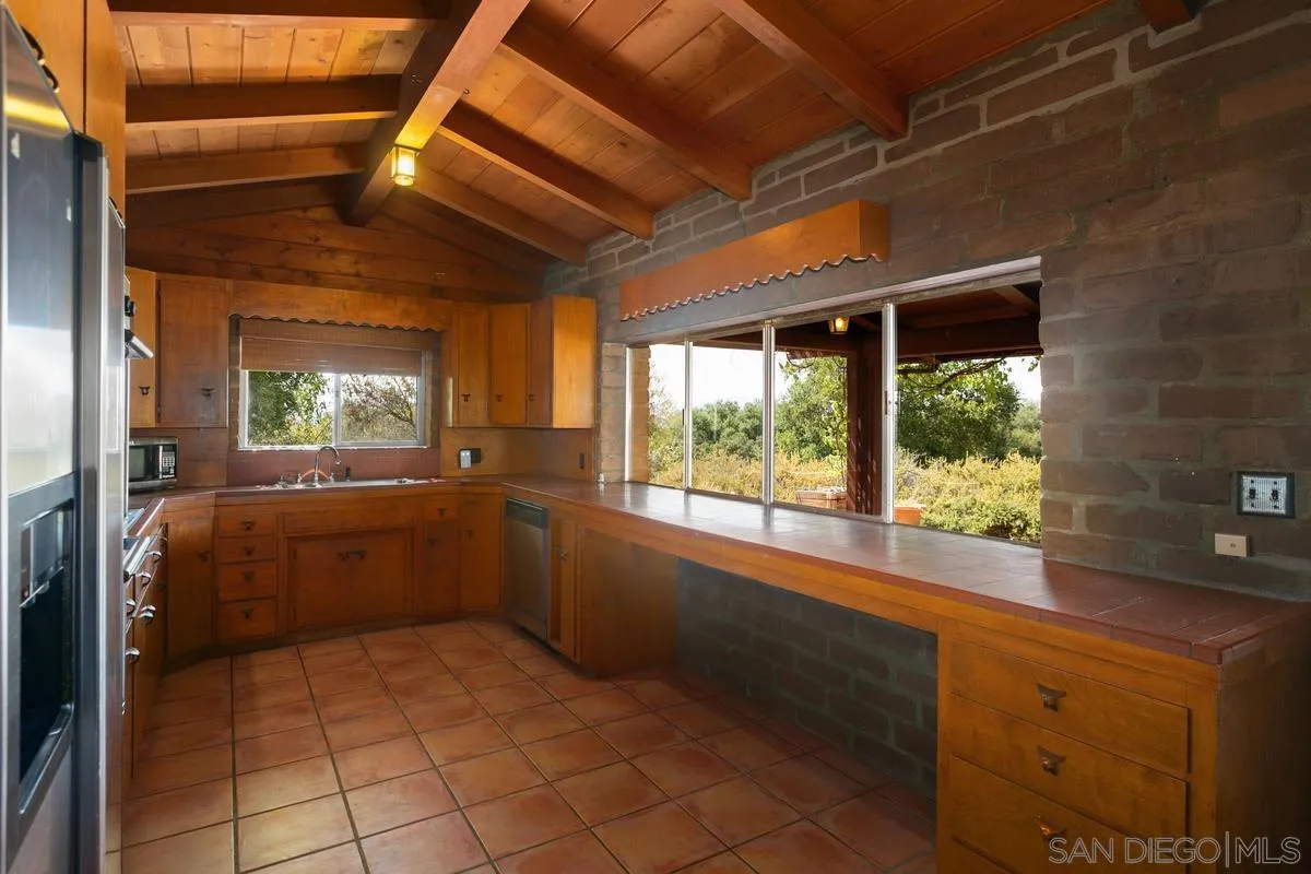 32630 Camino Moro Warner Springs, CA 92086 - Photo 14 of 33 a kitchen with a window and a refrigerator