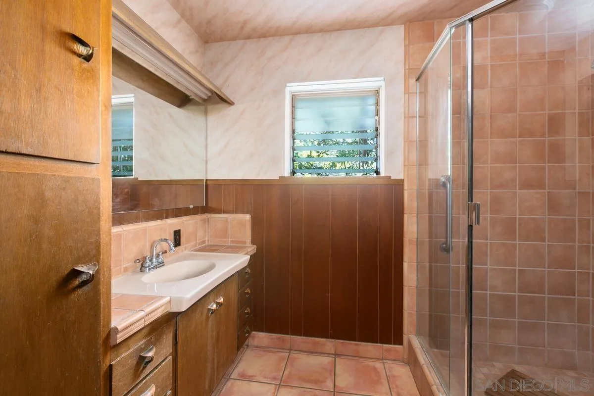 32630 Camino Moro Warner Springs, CA 92086 - Photo 22 of 33 a bathroom with a granite countertop sink and a mirror